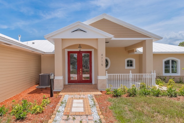 doorway to property with french doors and central AC unit