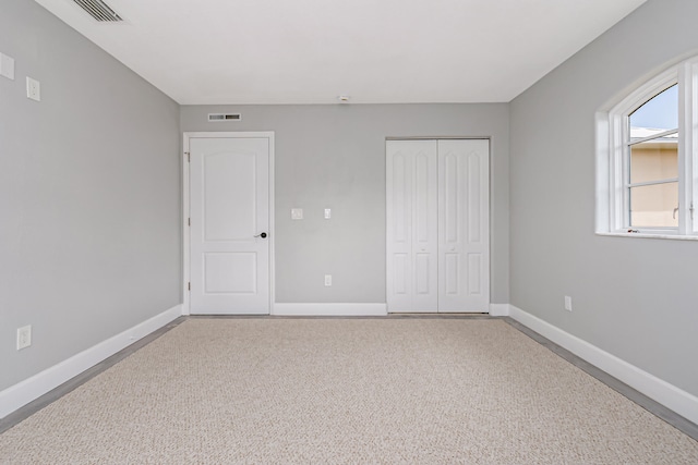 unfurnished bedroom with a closet