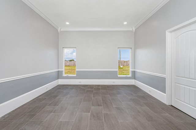 empty room with plenty of natural light and crown molding