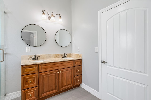 bathroom with double sink vanity and tile patterned flooring