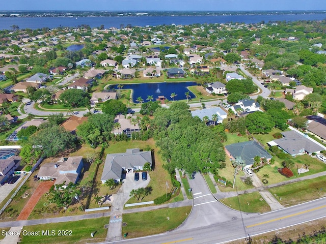 drone / aerial view with a water view