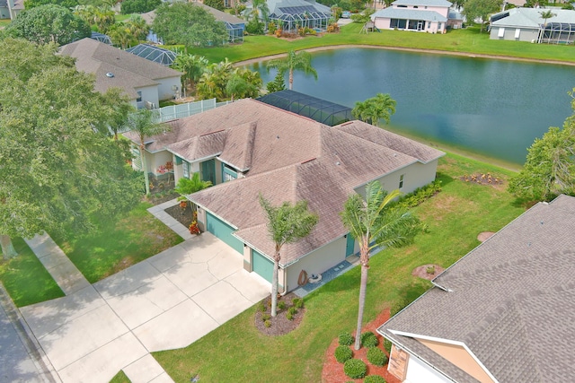 birds eye view of property with a water view