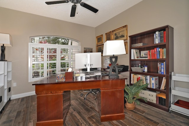 home office featuring a textured ceiling, ceiling fan, and dark wood-type flooring