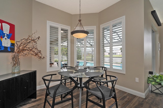 dining space featuring dark hardwood / wood-style floors