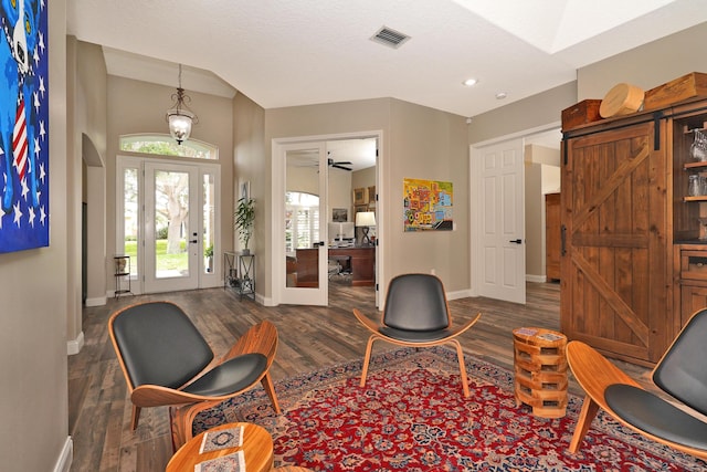 living area featuring ceiling fan, french doors, and dark hardwood / wood-style floors