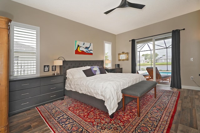 bedroom with ceiling fan, dark wood-type flooring, and access to outside