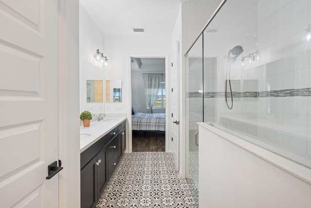 bathroom with vanity, tile patterned floors, and an enclosed shower