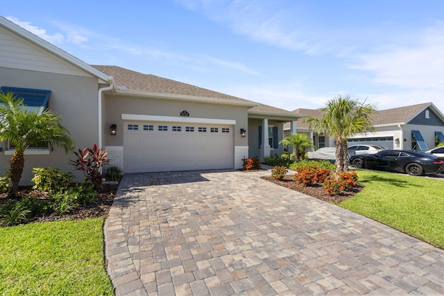 single story home with a garage and a front yard