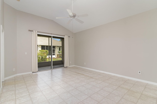 empty room featuring ceiling fan, vaulted ceiling, and light tile floors