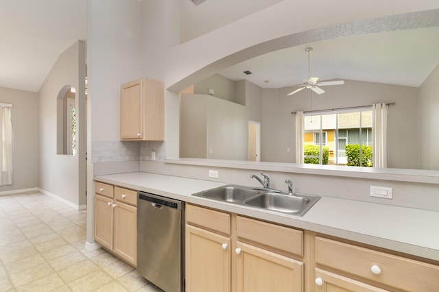 kitchen with light tile floors, sink, dishwasher, and light brown cabinetry