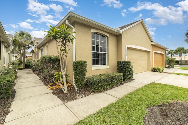 view of side of property with a garage