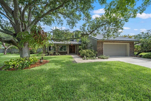 ranch-style home with a garage and a front lawn