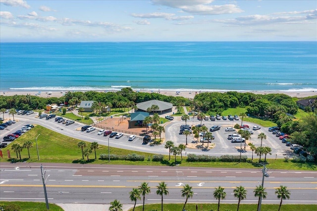 bird's eye view featuring a view of the beach and a water view