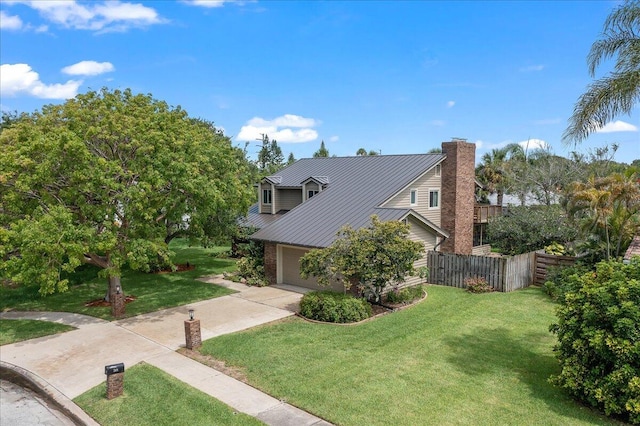 view of home's exterior featuring a lawn and a garage