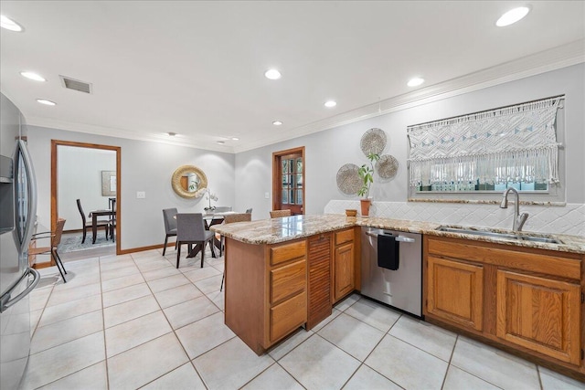 kitchen featuring sink, kitchen peninsula, crown molding, light tile patterned flooring, and appliances with stainless steel finishes