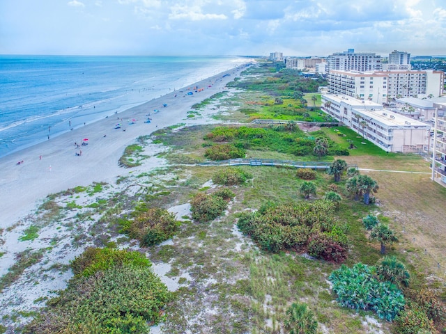 bird's eye view with a view of the beach and a water view