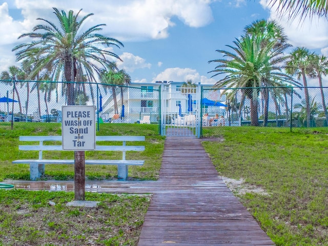 view of property's community featuring a lawn