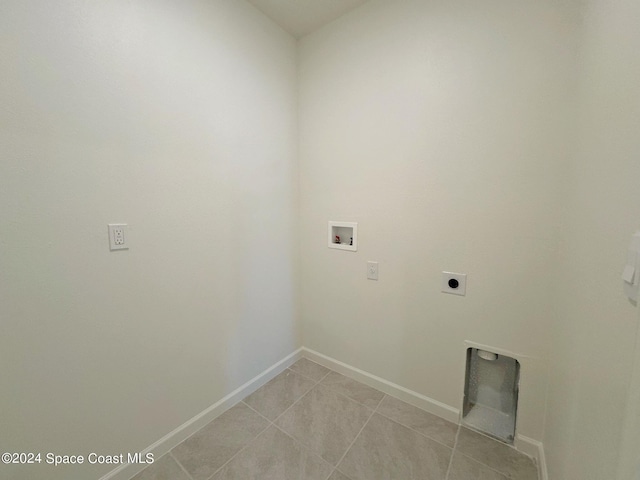 laundry area with light tile patterned floors, washer hookup, and hookup for an electric dryer