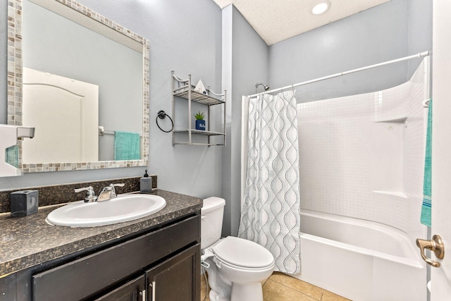 full bathroom featuring tile patterned floors, shower / bath combo, toilet, vanity, and a textured ceiling