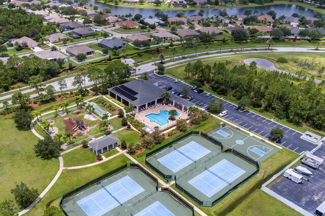 birds eye view of property with a water view