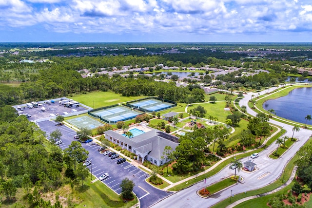 birds eye view of property with a water view