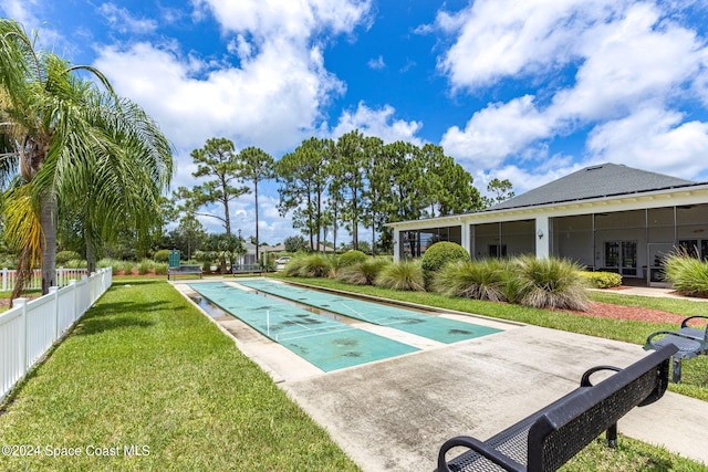 view of pool with a lawn