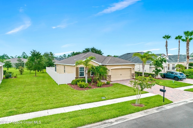 single story home with a front yard and a garage