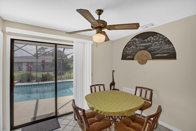 dining area featuring light tile patterned flooring