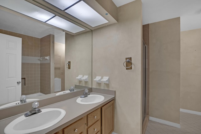 bathroom featuring vanity, tile patterned floors, and a shower with shower door