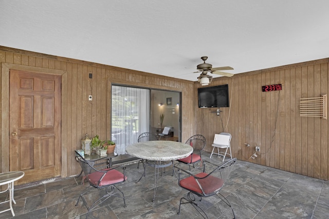 view of patio featuring ceiling fan