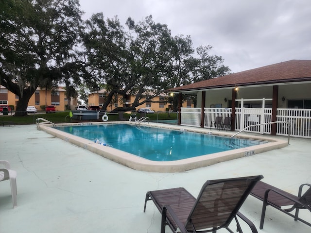 view of swimming pool featuring a patio area