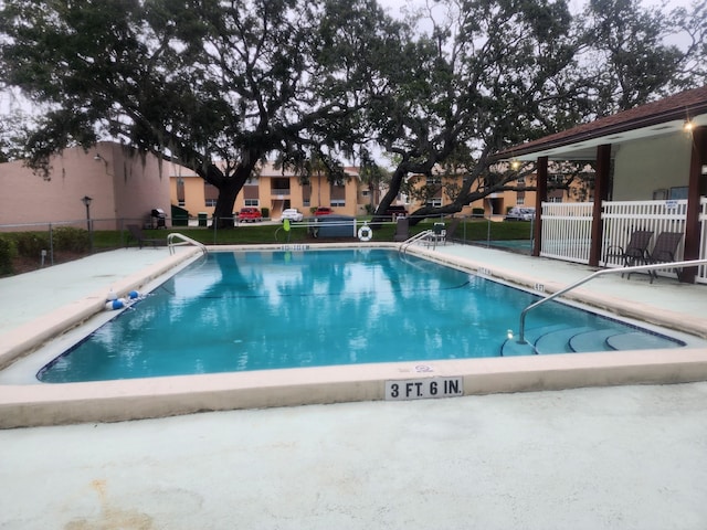 view of swimming pool featuring a patio area