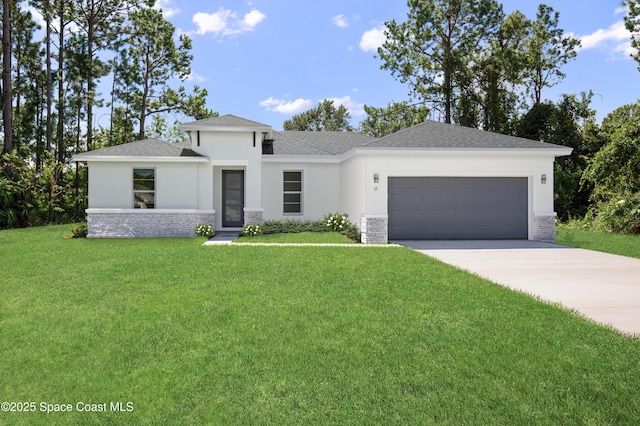 prairie-style home with a garage and a front lawn