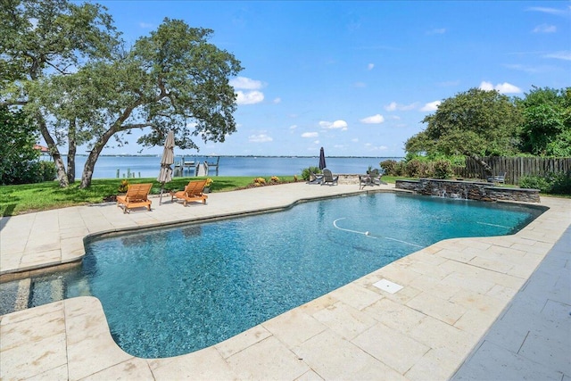 view of swimming pool with a patio area and a water view