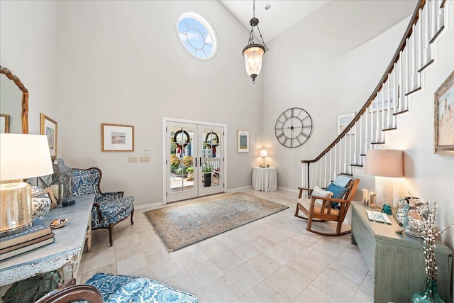 foyer featuring french doors, high vaulted ceiling, and a wealth of natural light