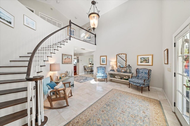 tiled foyer with high vaulted ceiling