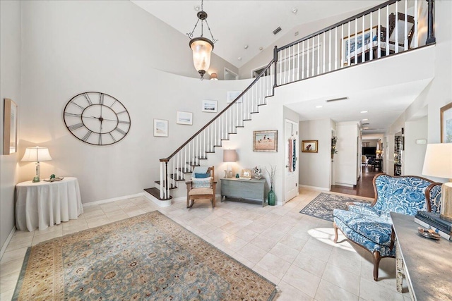 tiled living room with high vaulted ceiling