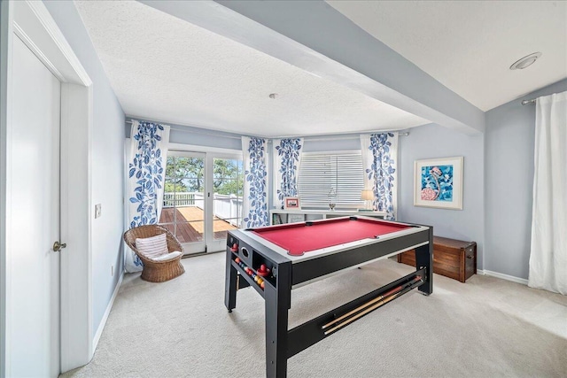 game room with carpet flooring, french doors, a textured ceiling, and billiards