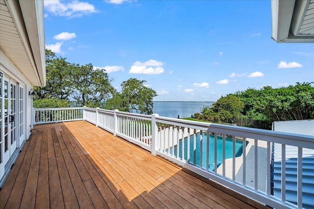 wooden deck featuring a water view