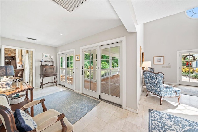 doorway with french doors and light tile patterned floors