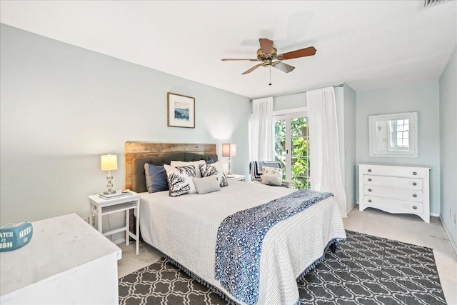 carpeted bedroom with ceiling fan