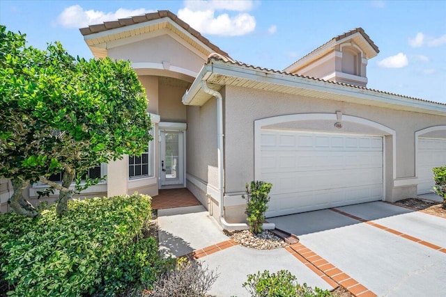 mediterranean / spanish house featuring a garage