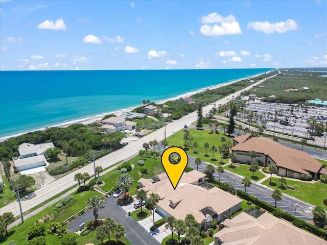 aerial view featuring a water view and a view of the beach