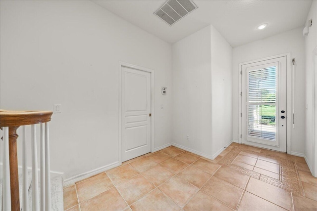 doorway featuring light tile patterned floors