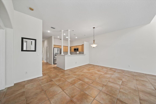 unfurnished living room with light tile patterned flooring