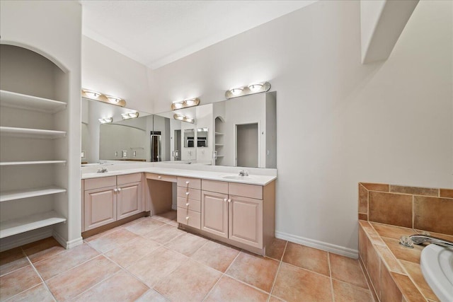 bathroom with vanity, built in features, and tiled bath