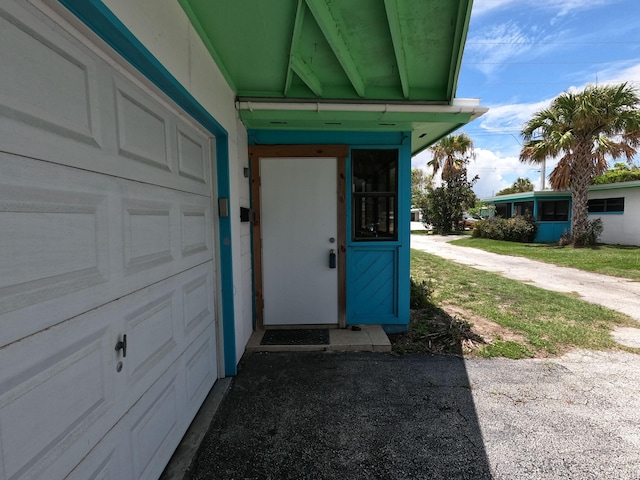 entrance to property featuring a garage