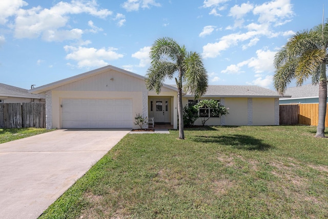 ranch-style house featuring a front yard and a garage