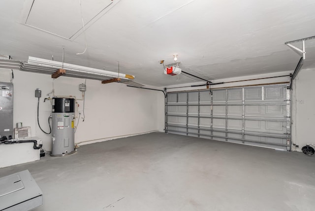 garage with water heater and a garage door opener