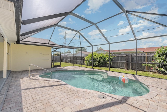 view of pool featuring a lanai and a patio